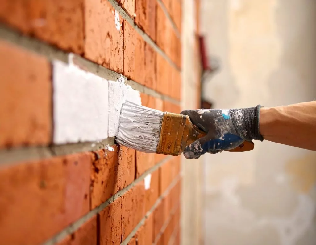 masonry primer being applied